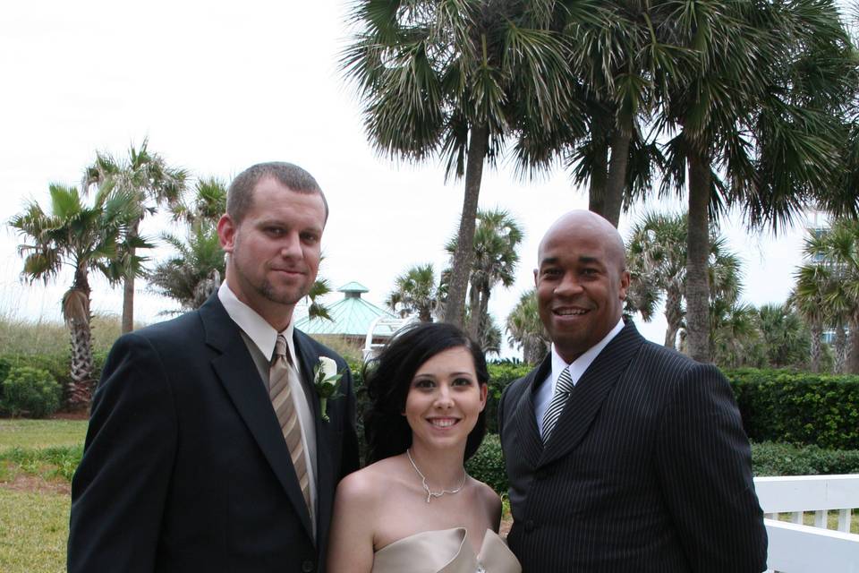 Newlyweds with their officiant