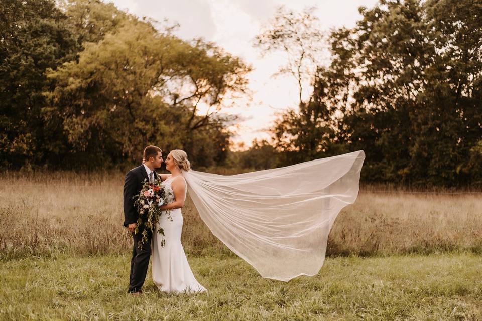 Couple with veil flying