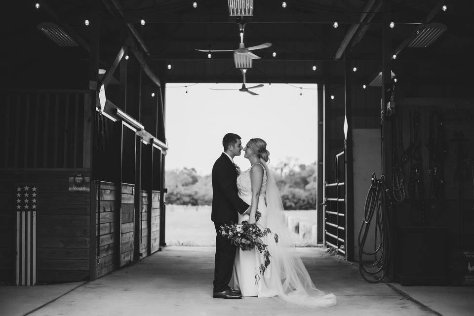 Couple kissing in barn