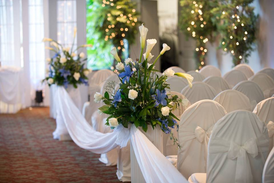 Floral arrangement on the aisle seats