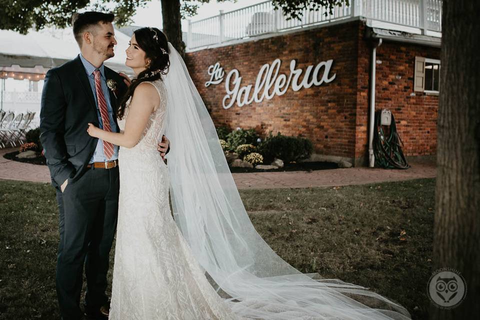 Couple pose outside venue