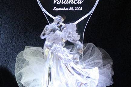 A uniquely lighted & personalized ice-like sculpture Wilton Bianca Bride & Groom Cake Top.  Personalized with couples names & wedding date.  Color lights are available, as well as the RGB Constant Color Changing Light.  Many Other Themes Available at cakelights.com