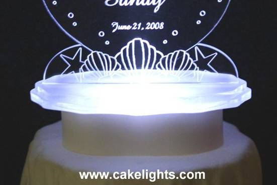 Lighted Personalized Seahorse & Shell Cake Top.  Personalized with couple's names & wedding date.  Color lights available, as well as the RGB constant color changing light.  Other Sea Themes Available.