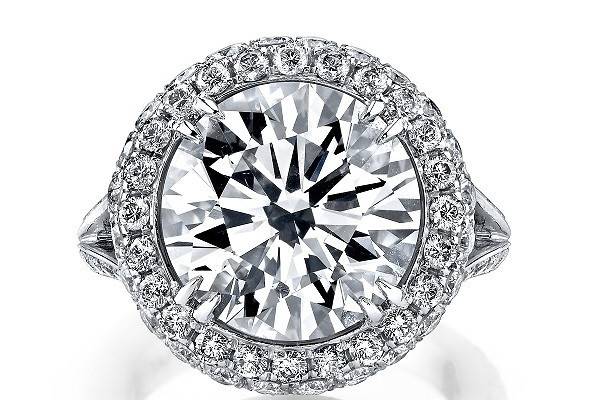 Gorgeous platinum custom large white diamond ring with brilliant-cut diamond double halo. Beautiful scroll filigree gallery with diamond pave split shank.