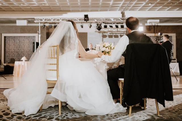 Bride and groom seated for dining