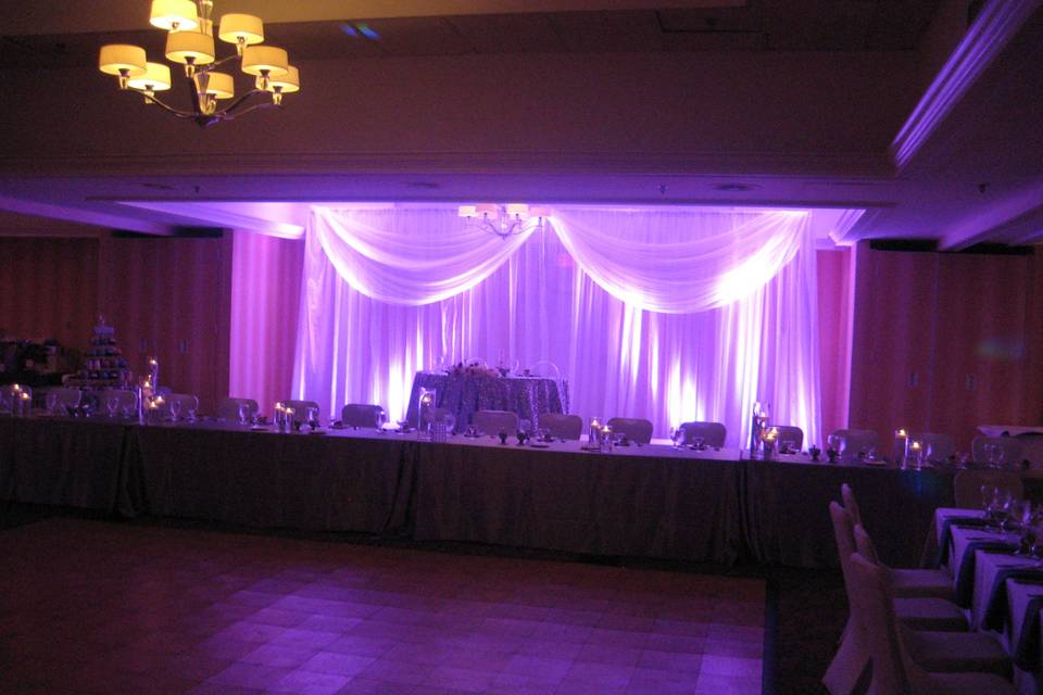 Gorgeous pink wall up-lighting for wedding reception.