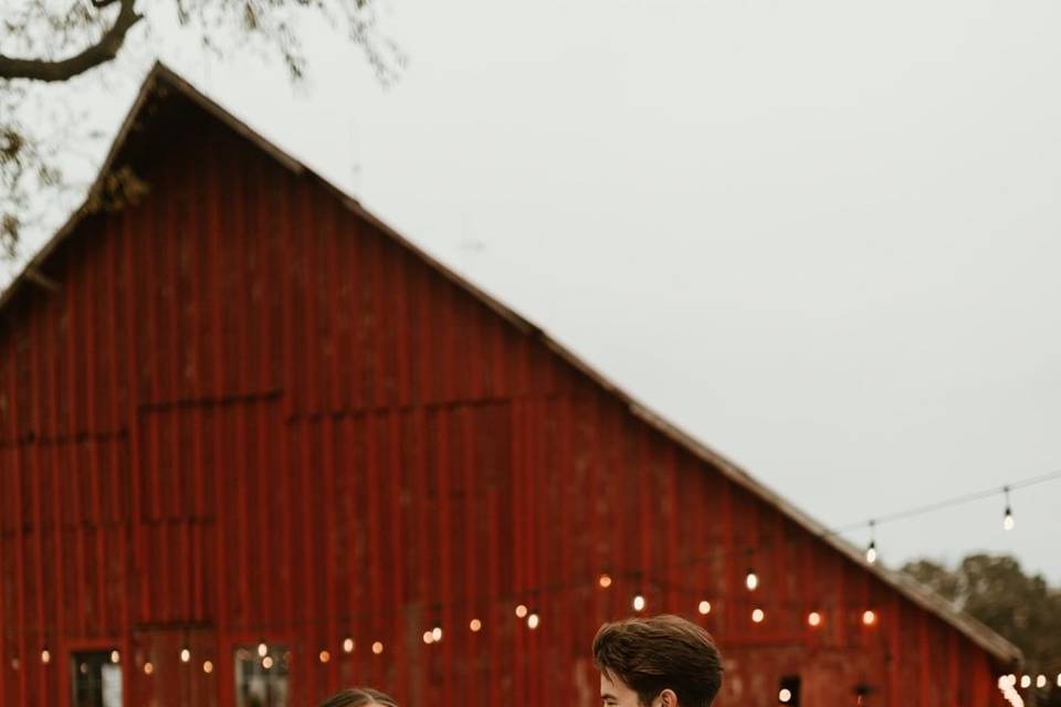 Couple in front of the barn