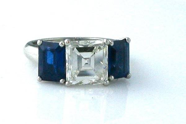 Flank a center diamond with color! Hand made setting. Can be made with any size/shape stones. This particular ring was crafted around an inherited stone.