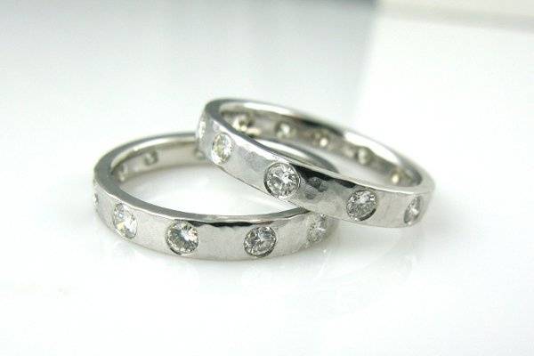 Wedding Bands. 14K White gold with diamonds set in hand hammered band. Can be made in other widths.