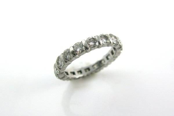 A classic eternity band. 18-.18pt diamonds make up this 3.24 ctw wedding ring set in platinum. Can be made using any size stones.