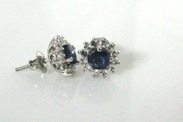 Blue sapphires with diamond cut white sapphires. Set in 14K white gold pre-cast setting with screw back posts. 1-2 week delivery.