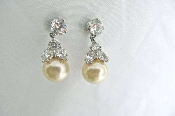 Diamond earrings with pearl drop. Shown here with pear accents and 10mm ivory south sea pearl. Can be made in other sizes using all round diamonds and freshwater or Tahitian pearl drop. 2-3 week delivery.