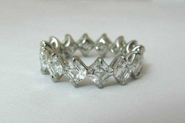 Corner to corner platinum and diamond eternity band. Collection quality asscher cut diamonds. DEF/VVS 6.01 tcw. GOL007. Can be made with other shape, size and quality diamonds.
