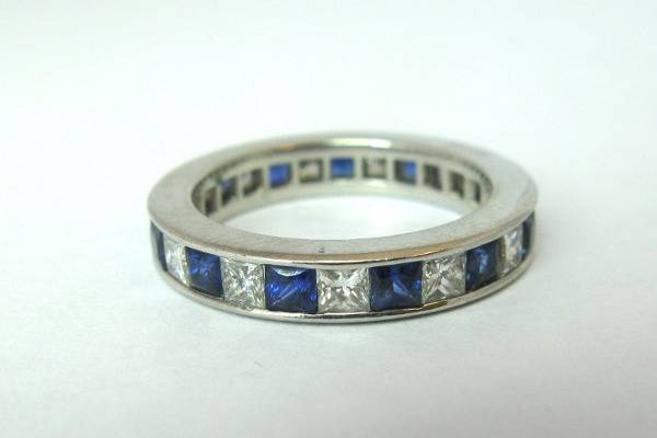 Sapphire and Diamond Eternity Band set in platinum. Princess Cut Diamonds with High Quality Square Sapphires. 1.58 ctw diamonds. 1 ctw sapphires. XR131. Can be made with other shape, size and quality diamonds.