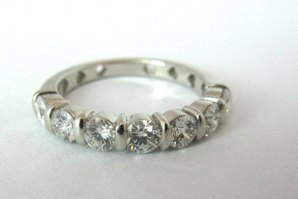 7 Stone Diamond Wedding Band. 18K white gold semi eternity band with seven brilliant round diamonds. 15 pts each. 1.05 ctw. GOL058. Can be made with other shape, size and quality diamonds.