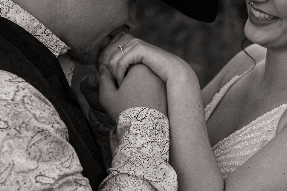 Groom kissing brides hands