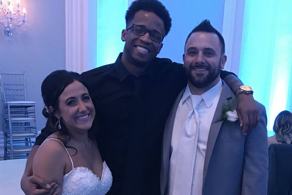 Bride, DJ, and groom
