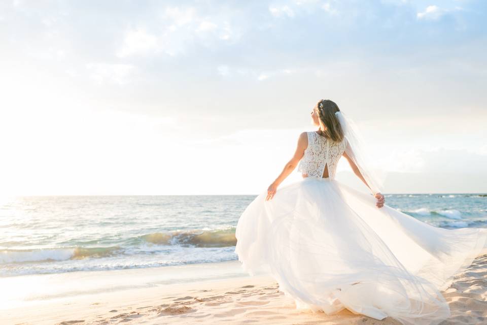 Beautiful bride on the beach taken by Maui wedding photographers Karma Hill Photography.
