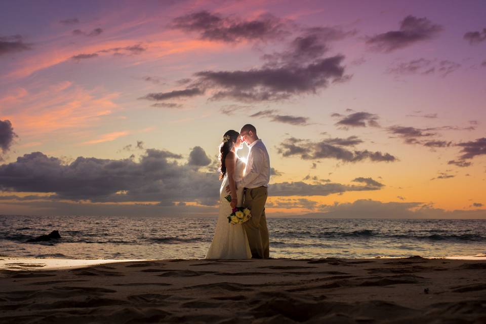 Romantic sunset wedding photo taken by Karma Hill Photography.