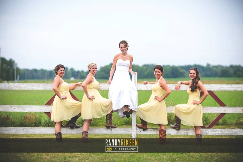 Bridesmaids in butter-yellow summer dresses and the lovely bride! (Photo courtesy of Randy Riksen)