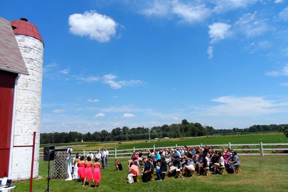 Outdoor wedding by the old silo on a warm sunny day!