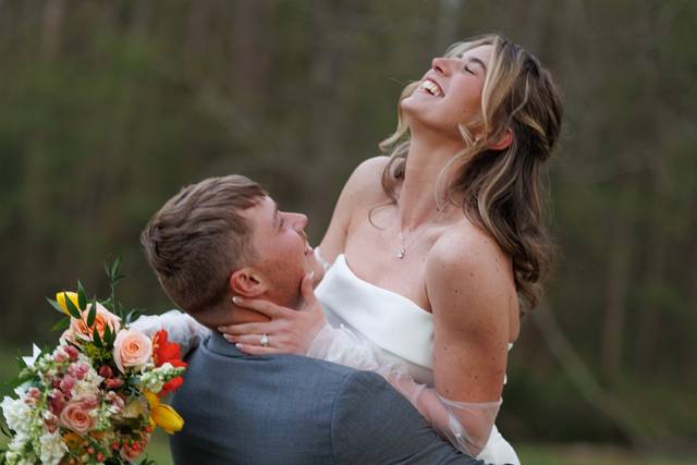 Groom lifting Bride
