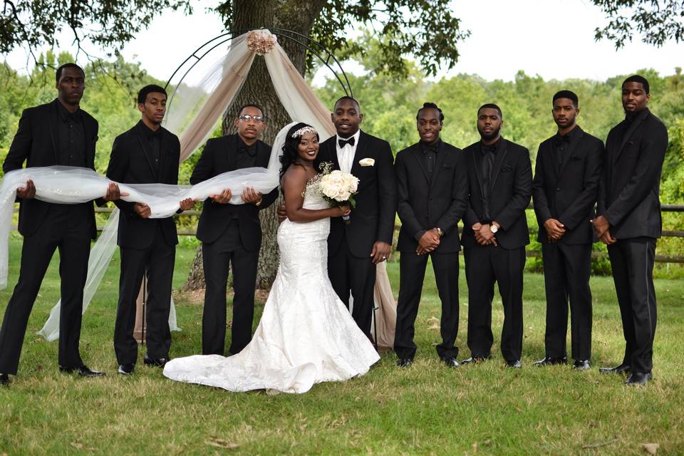 The couple with the groomsmen