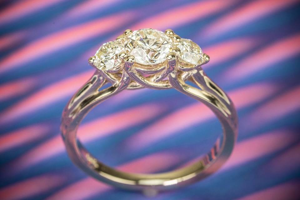 Intricate three stone engagement ring
