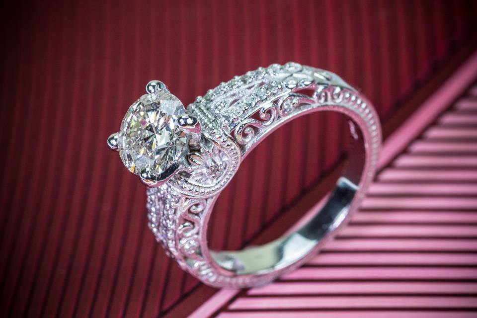 Side stone engagement ring