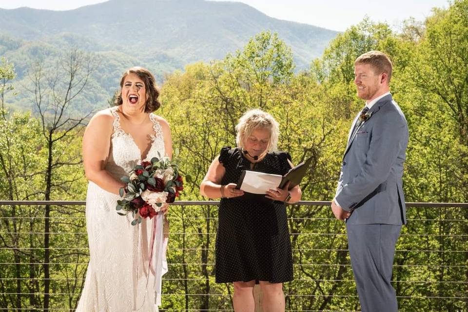 Officiant, bride and groom