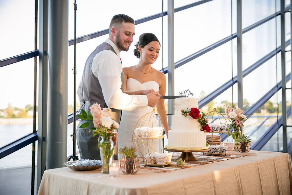 Couple and their wedding cake