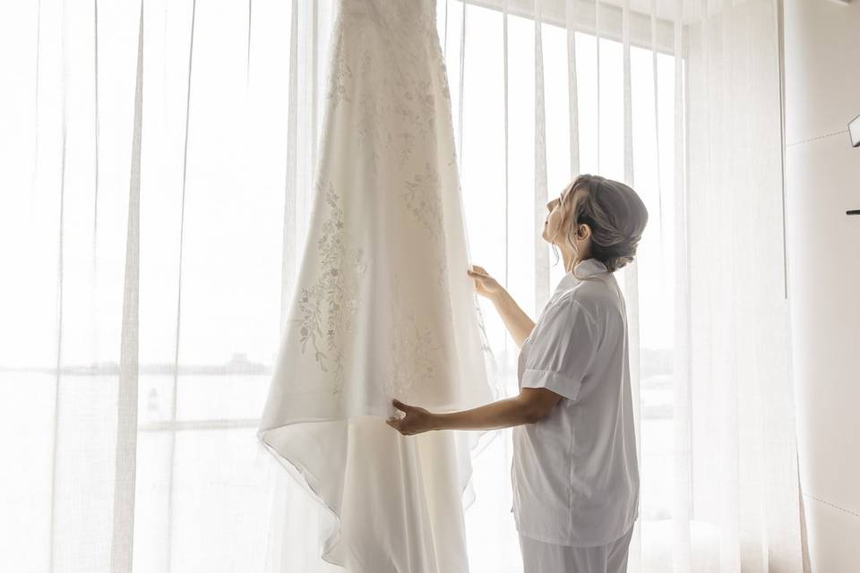 Bride touching dress