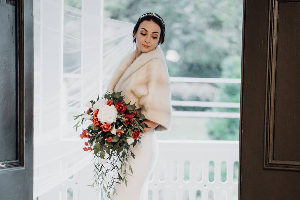 Bride on front porch of Inn