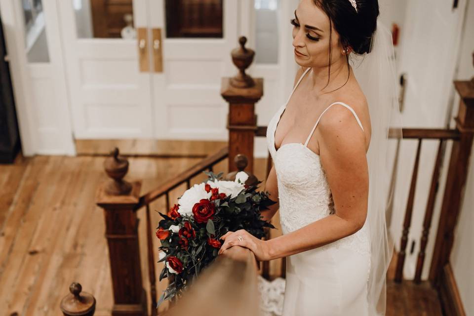 Bride on lobby stairs of Inn