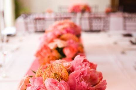 Elongated centerpiece,  Coral Peonies, Protea, Spray Roses