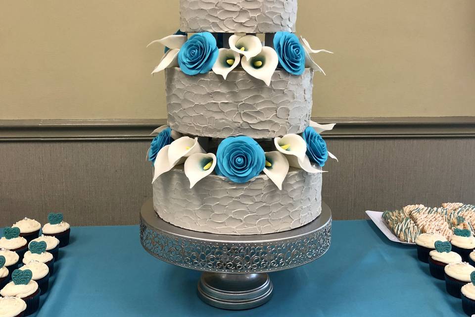 3-tier cake with blue and white flowers