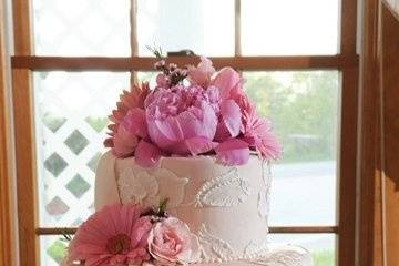 Hand-painted sugar embroidery, draped in sugar on pink buttercream tiers......