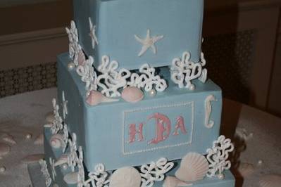 Sugar shells and sealife on buttercream tiers