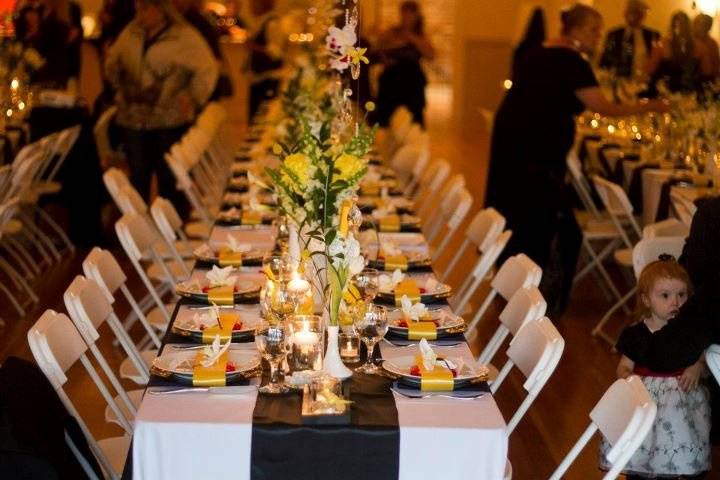 Table setup with candle and floral centerpiece