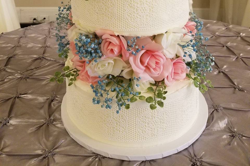 Three tier cake with flower separators