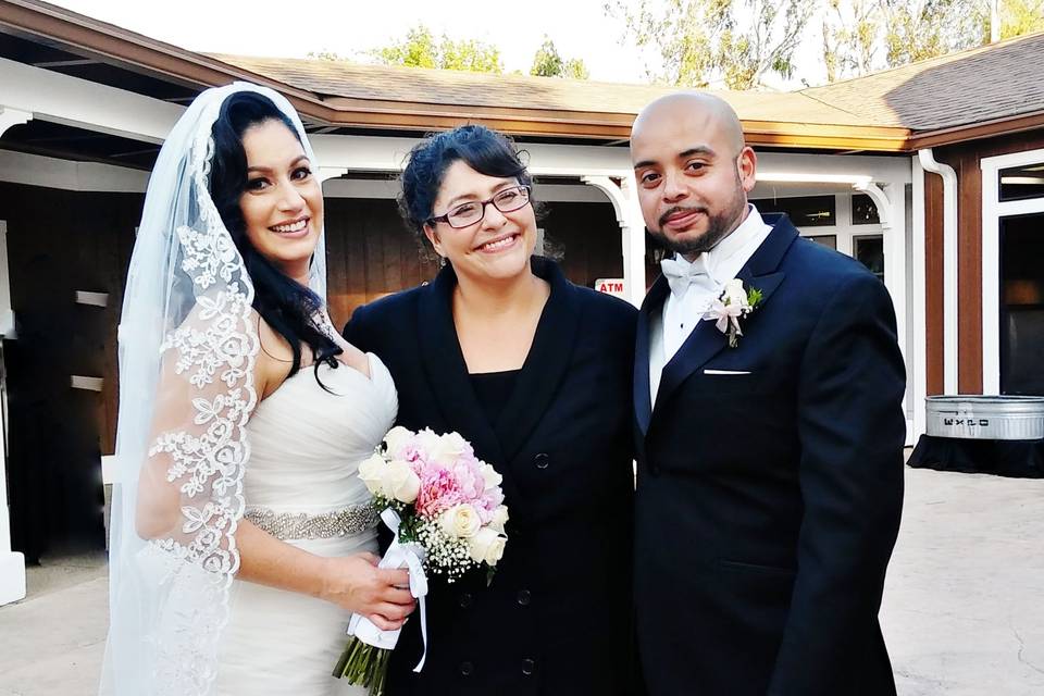 Newlyweds and officiant