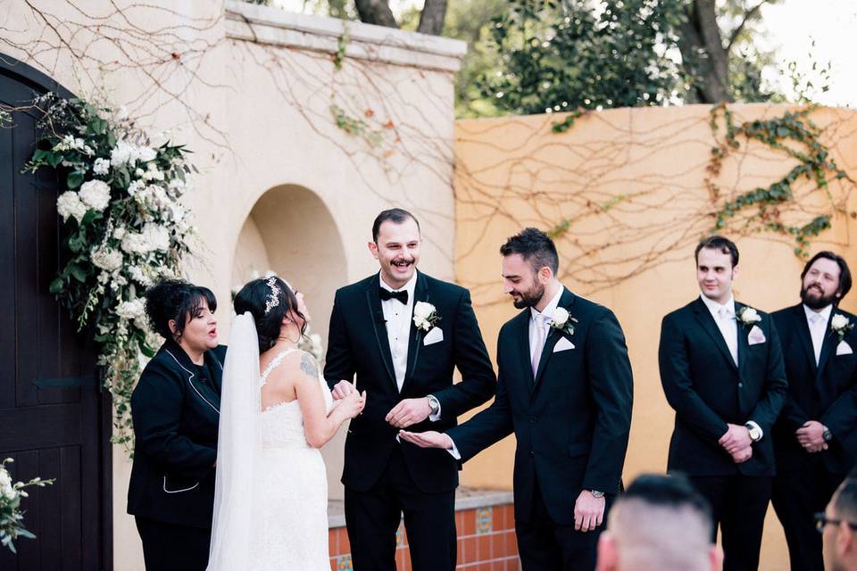 Newlyweds and officiant