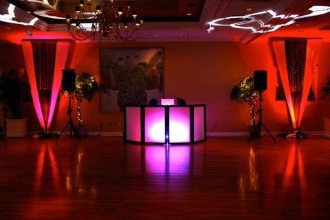 wedding lighting with 2 gobo projections, lighted LED dj facade, red uplighting, and 2 speaker pro setup