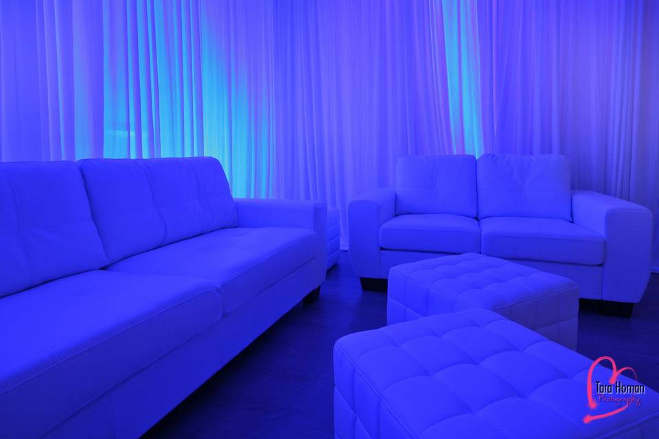 Lounge furniture with premium draping and uplighting rental in orlando