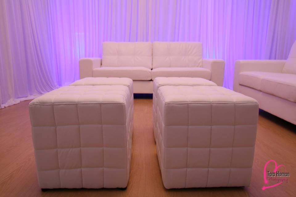 Lounge furniture with premium draping and uplighting rental in orlando