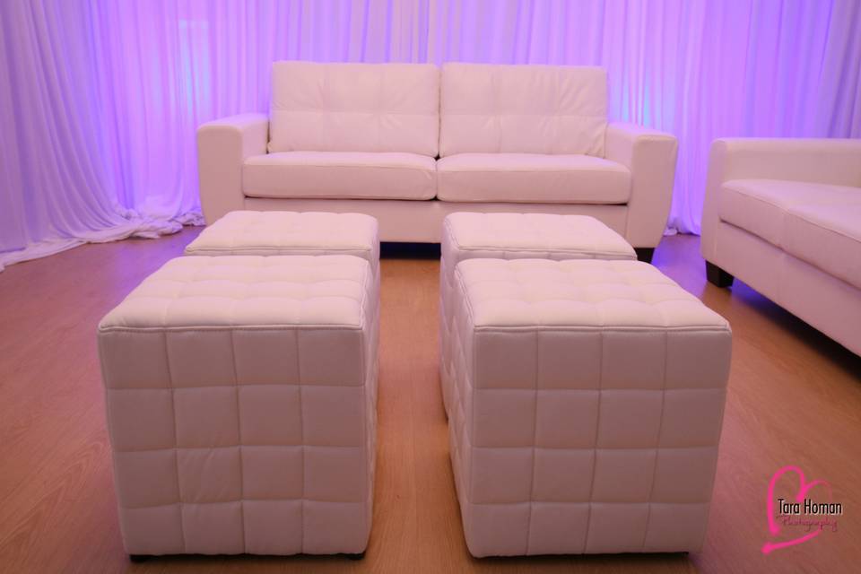 Lounge furniture with premium draping and uplighting rental in orlando
