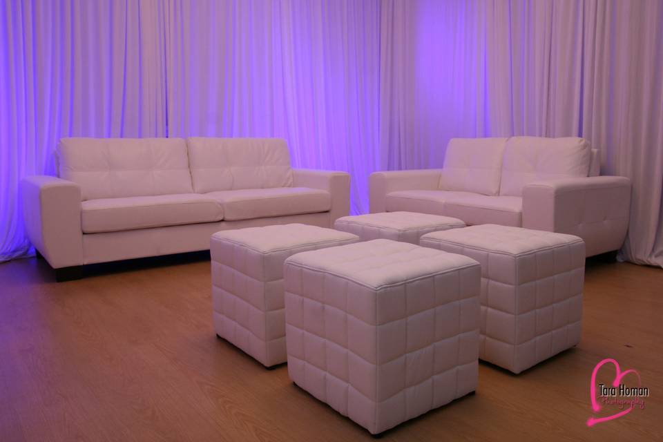 Lounge furniture with premium draping and uplighting rental in orlando