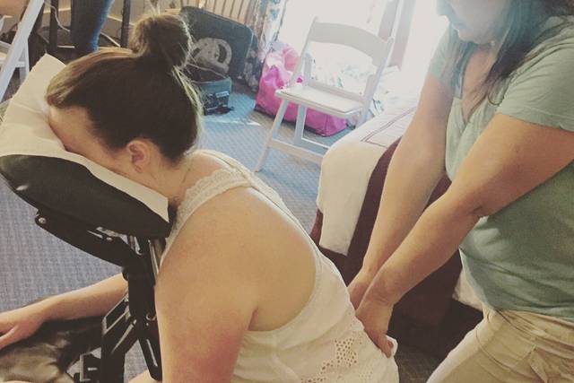 The bride gets a relaxing massage