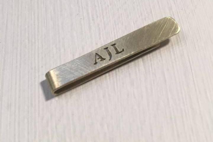 Custom, hand-cut initial brass tie bar