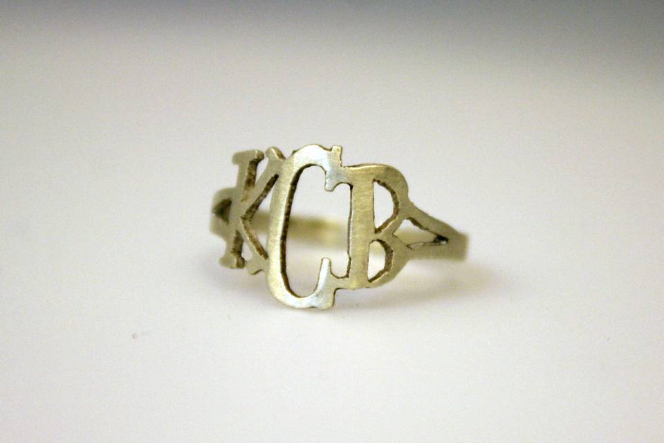 Custom, hand-cut initial ring in silver